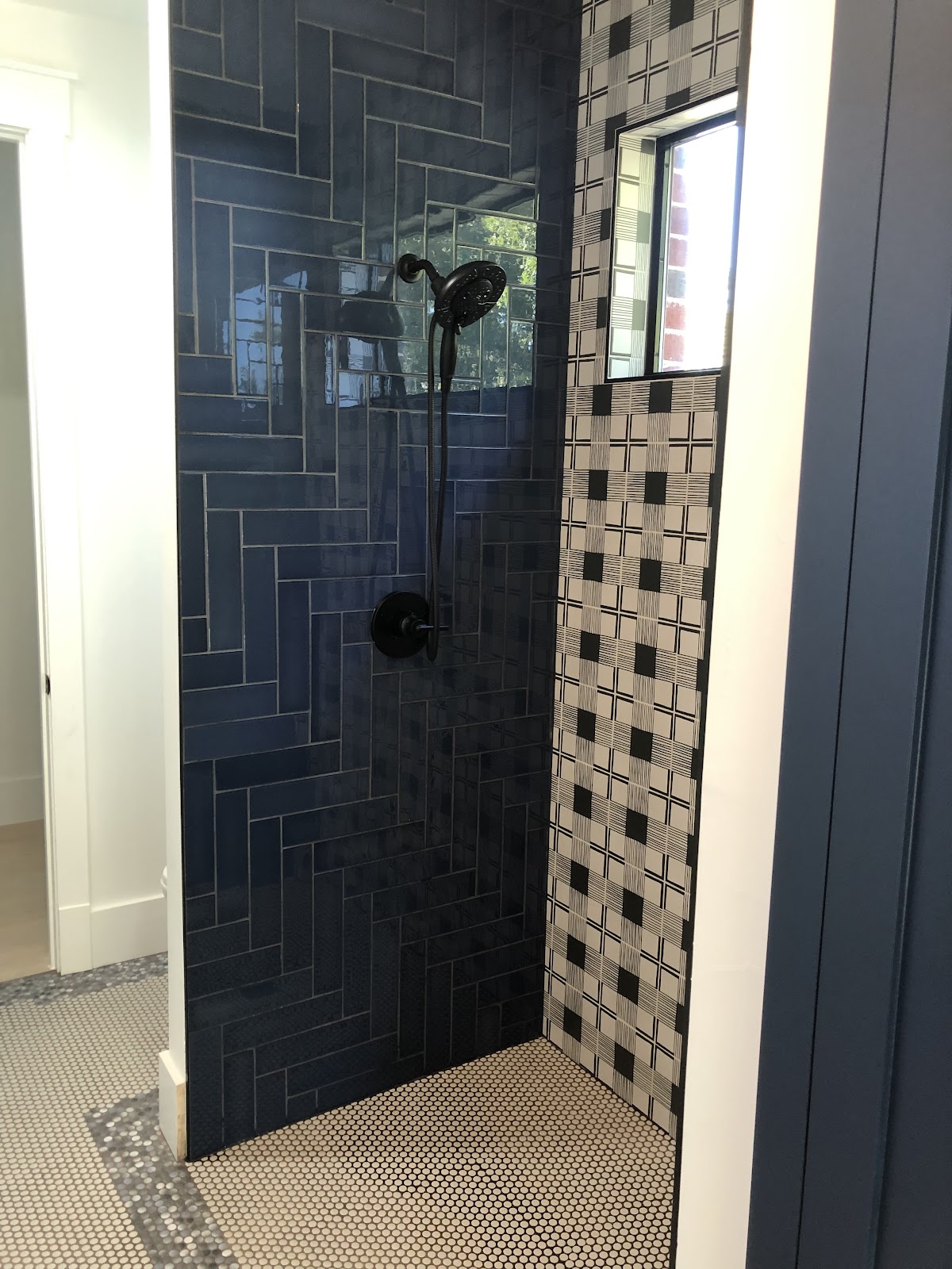 Custom herringbone tile shower remodel